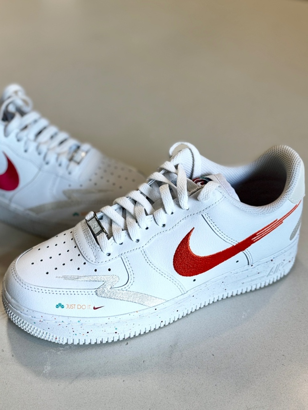 Nike Air Force 1 Low ’07 LX “Leap High” in White/White/Safety Orange/Washed Teal
